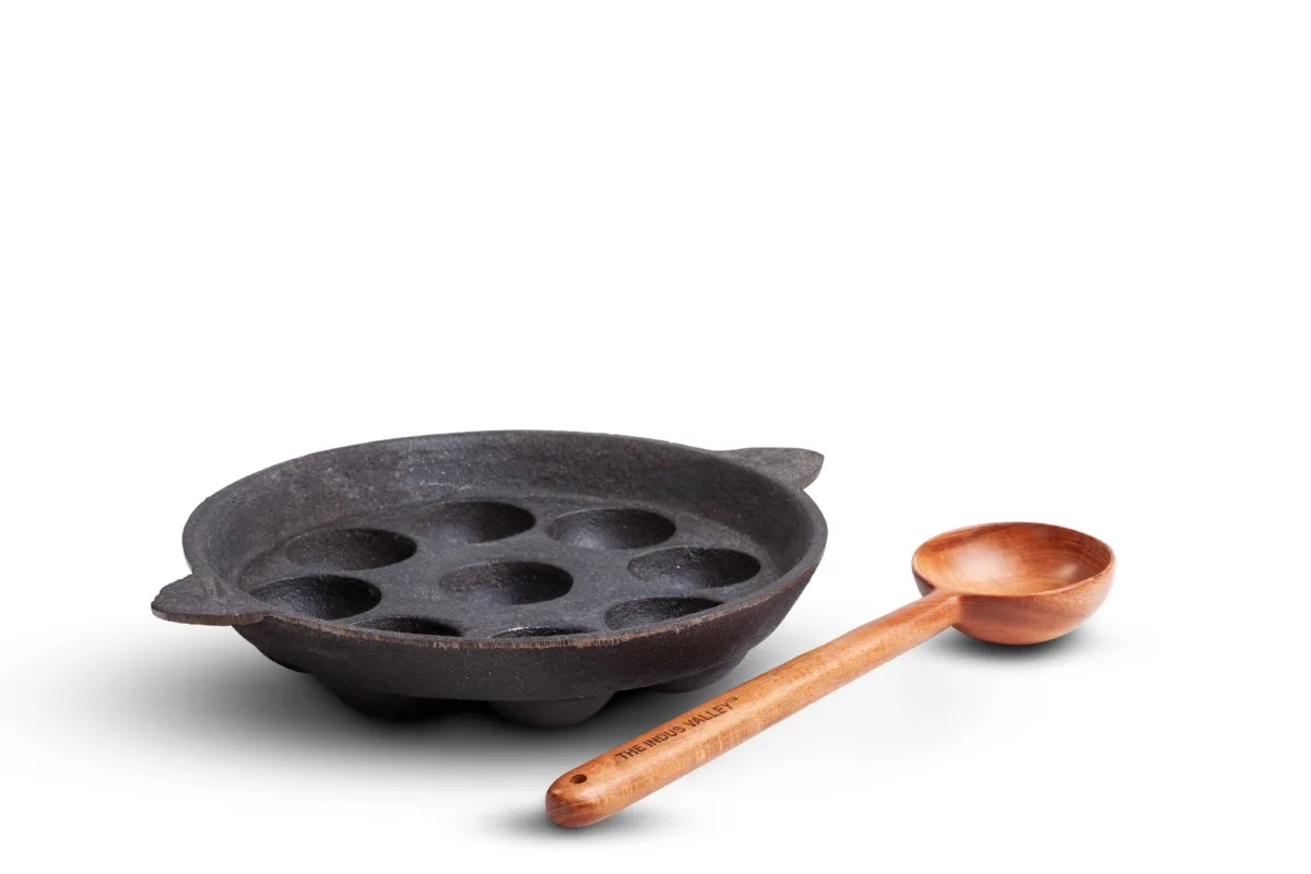 The Indus Valley cast iron paniyaram pan with wooden ladle